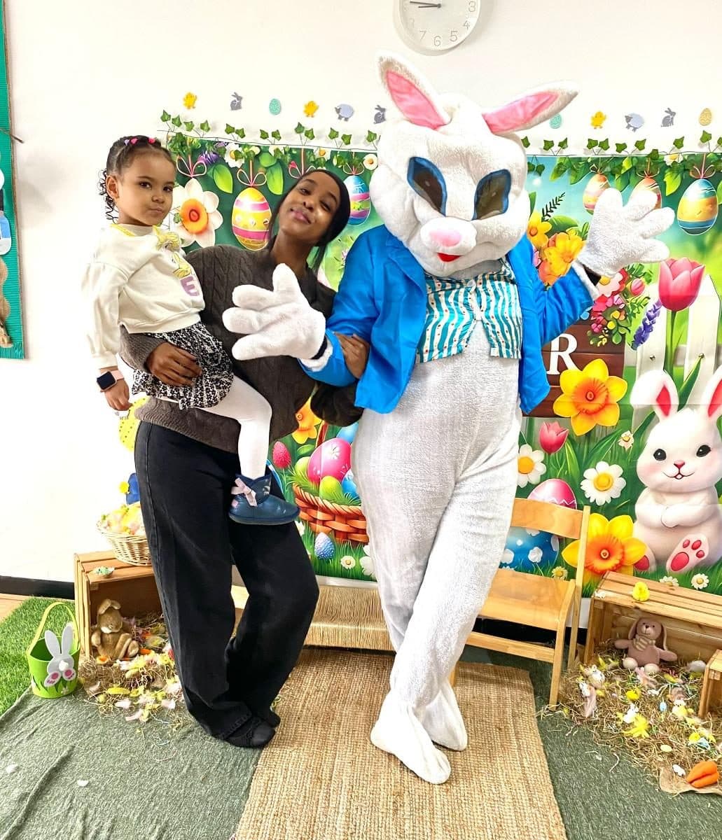 Blossoming Minds Daycare children with the Easter bunny mascot