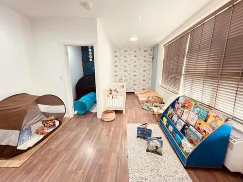 blossoming minds daycare organized playroom with toys and furniture